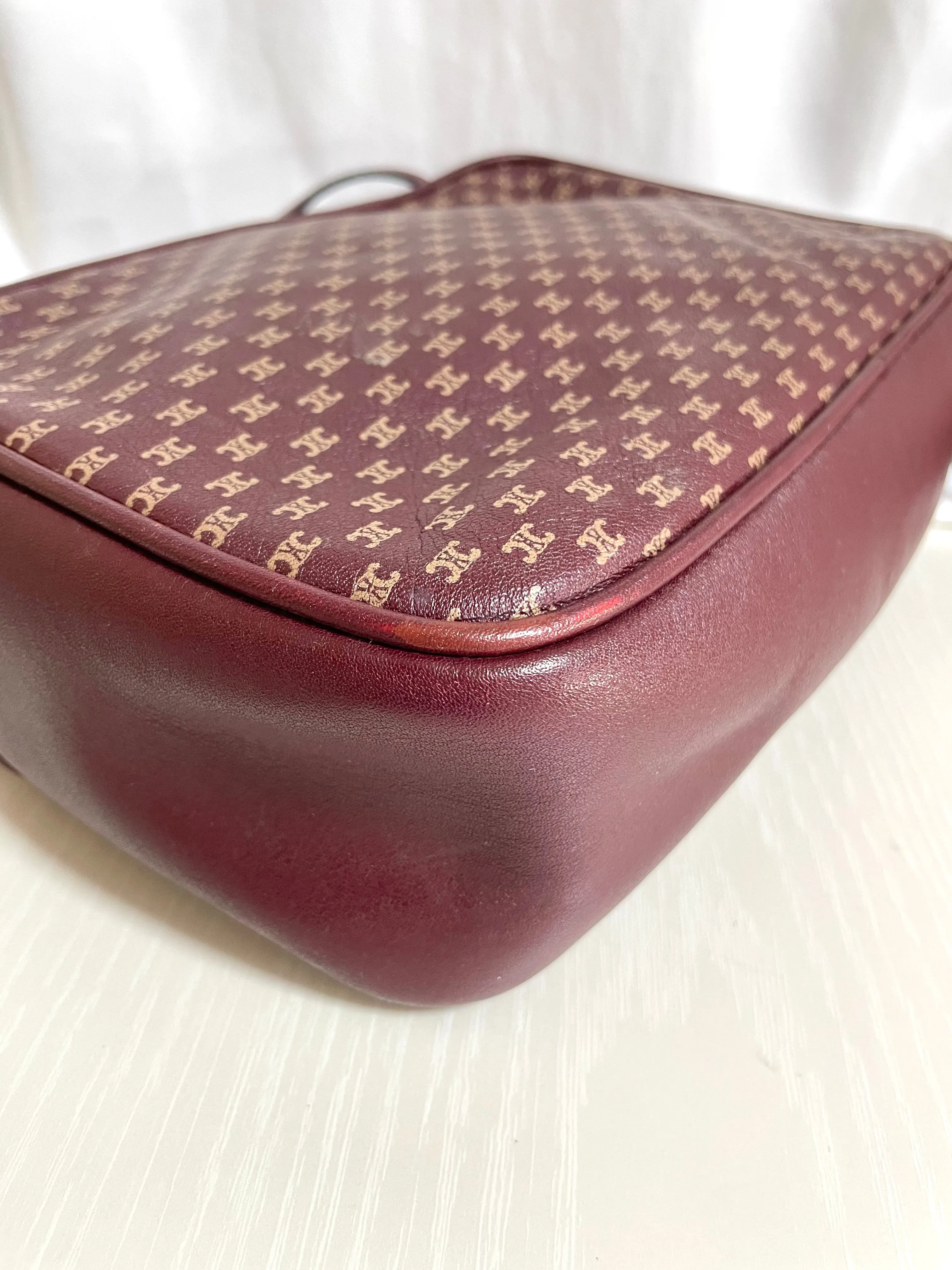 1980s. vintage Celine shoulder purse in bordeaux, burgundy leather with iconic blaison macadam print all over. riri zipper. 0411102
