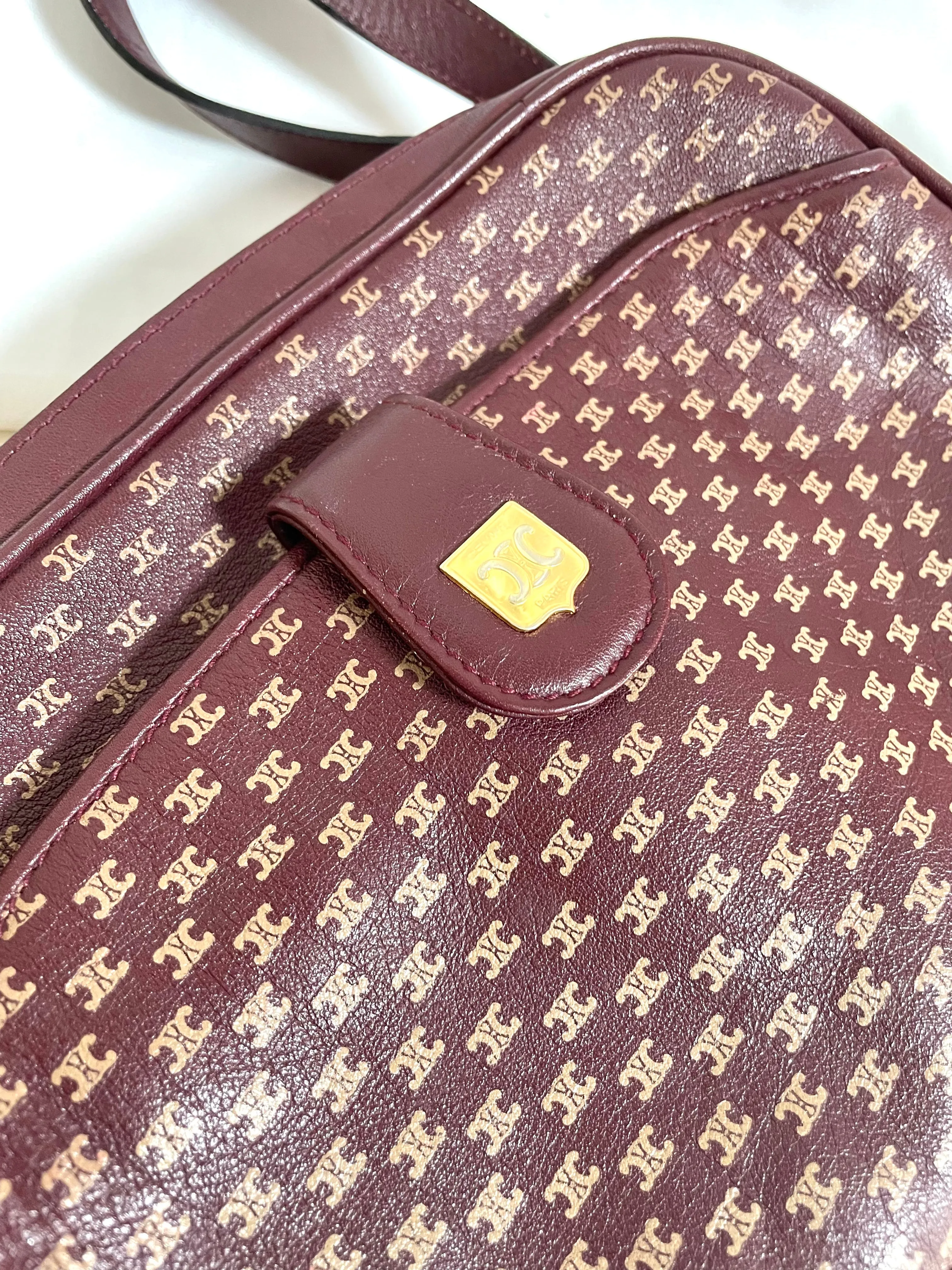 1980s. vintage Celine shoulder purse in bordeaux, burgundy leather with iconic blaison macadam print all over. riri zipper. 0411102