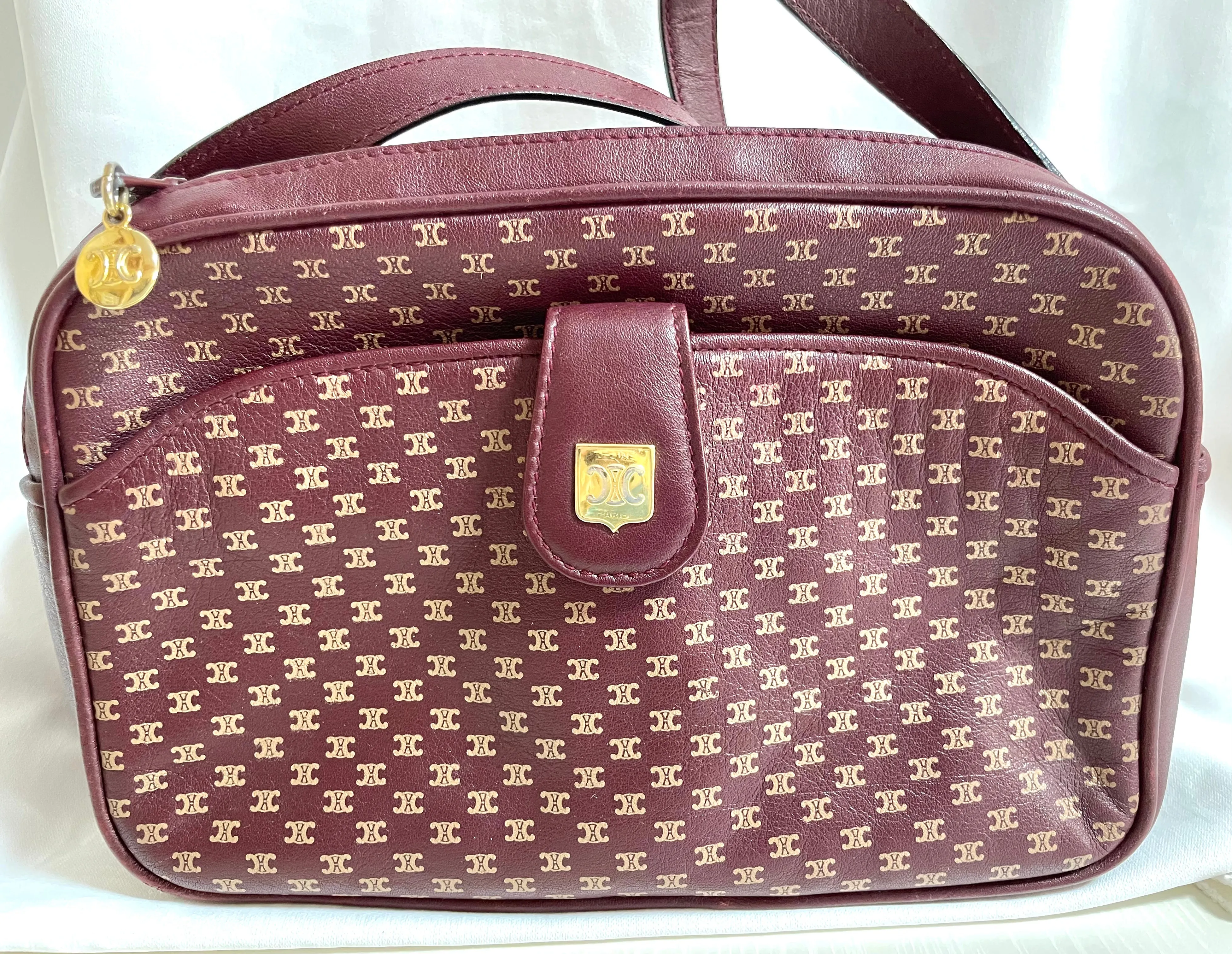 1980s. vintage Celine shoulder purse in bordeaux, burgundy leather with iconic blaison macadam print all over. riri zipper. 0411102