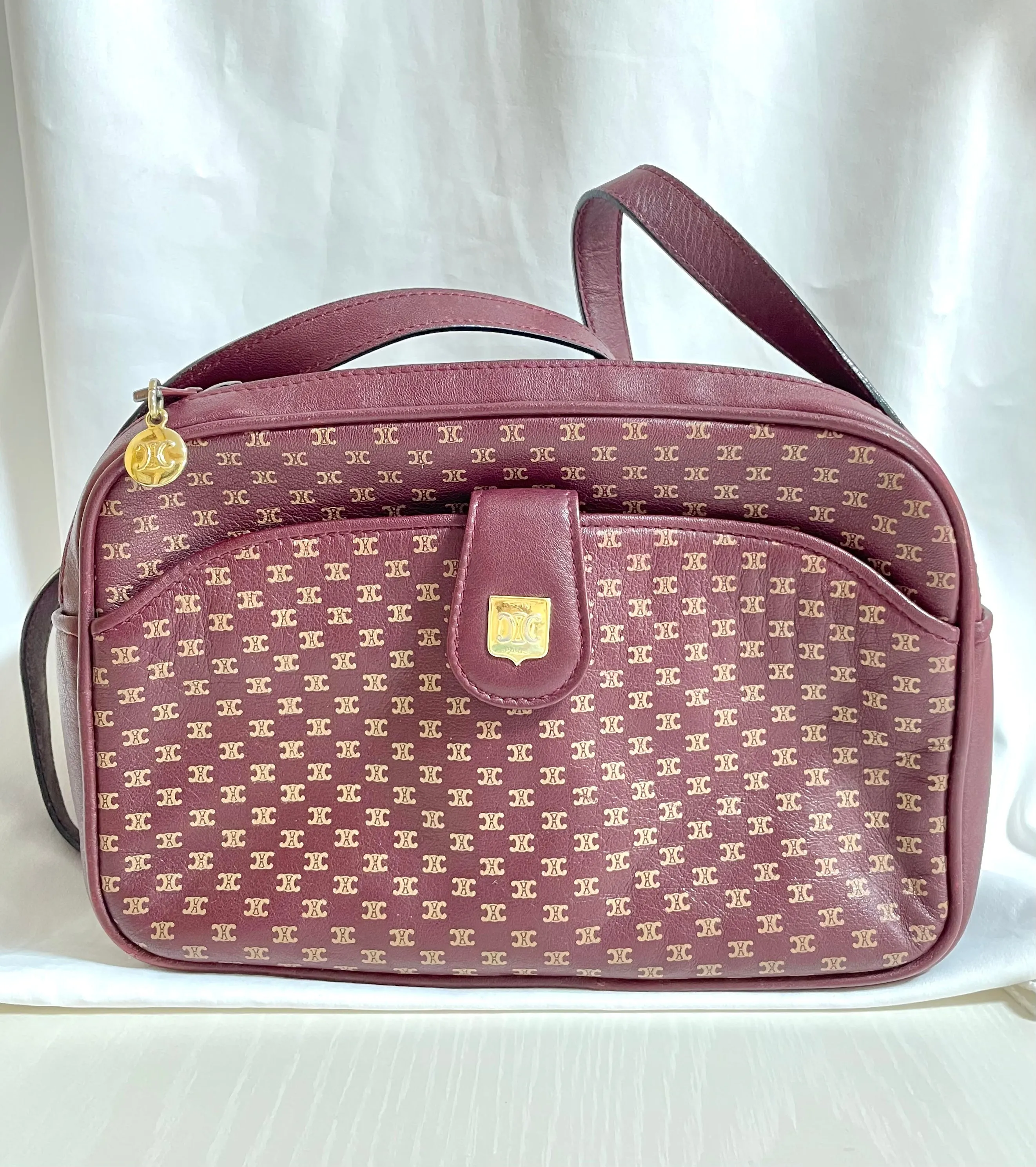 1980s. vintage Celine shoulder purse in bordeaux, burgundy leather with iconic blaison macadam print all over. riri zipper. 0411102