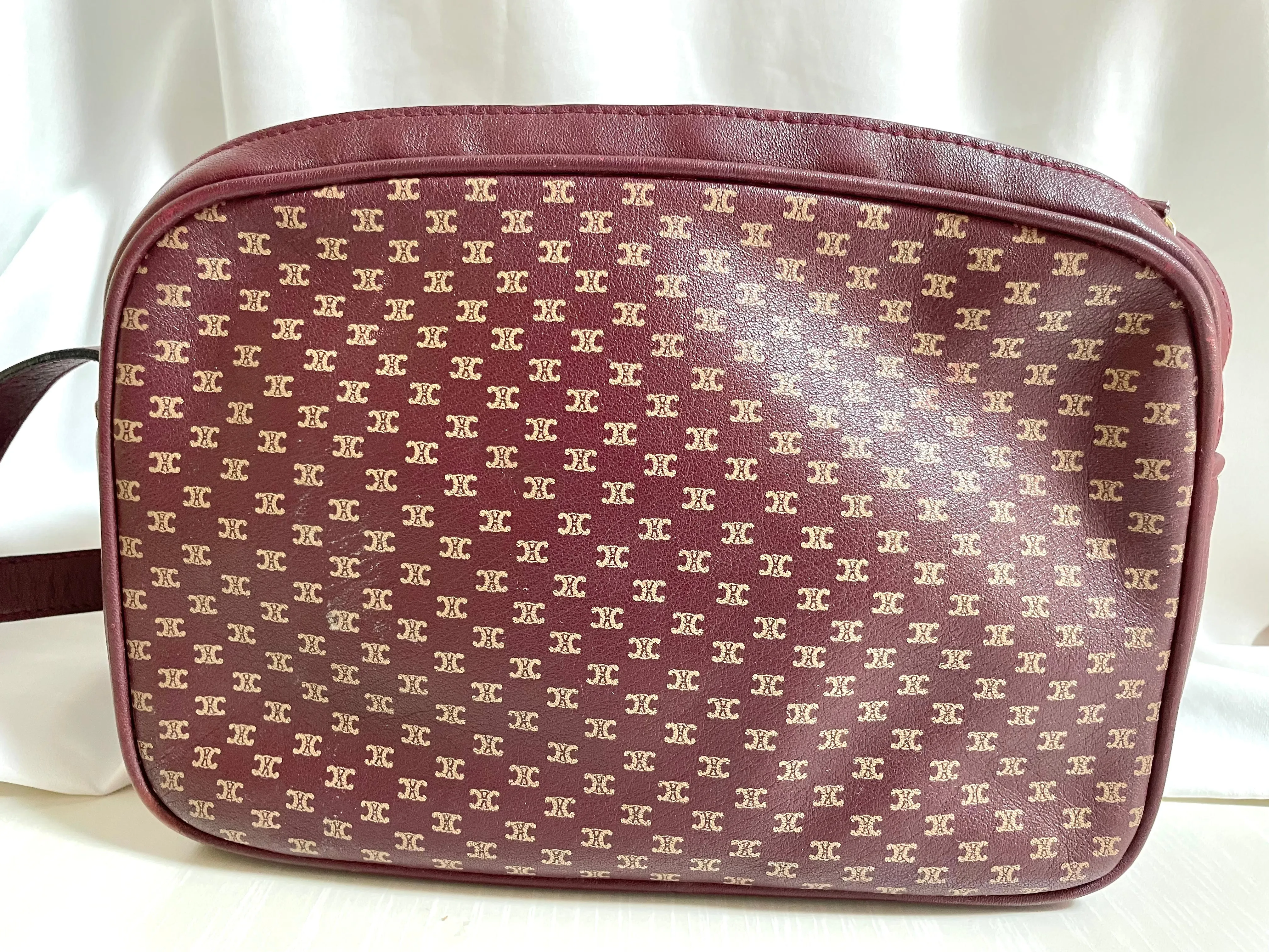 1980s. vintage Celine shoulder purse in bordeaux, burgundy leather with iconic blaison macadam print all over. riri zipper. 0411102