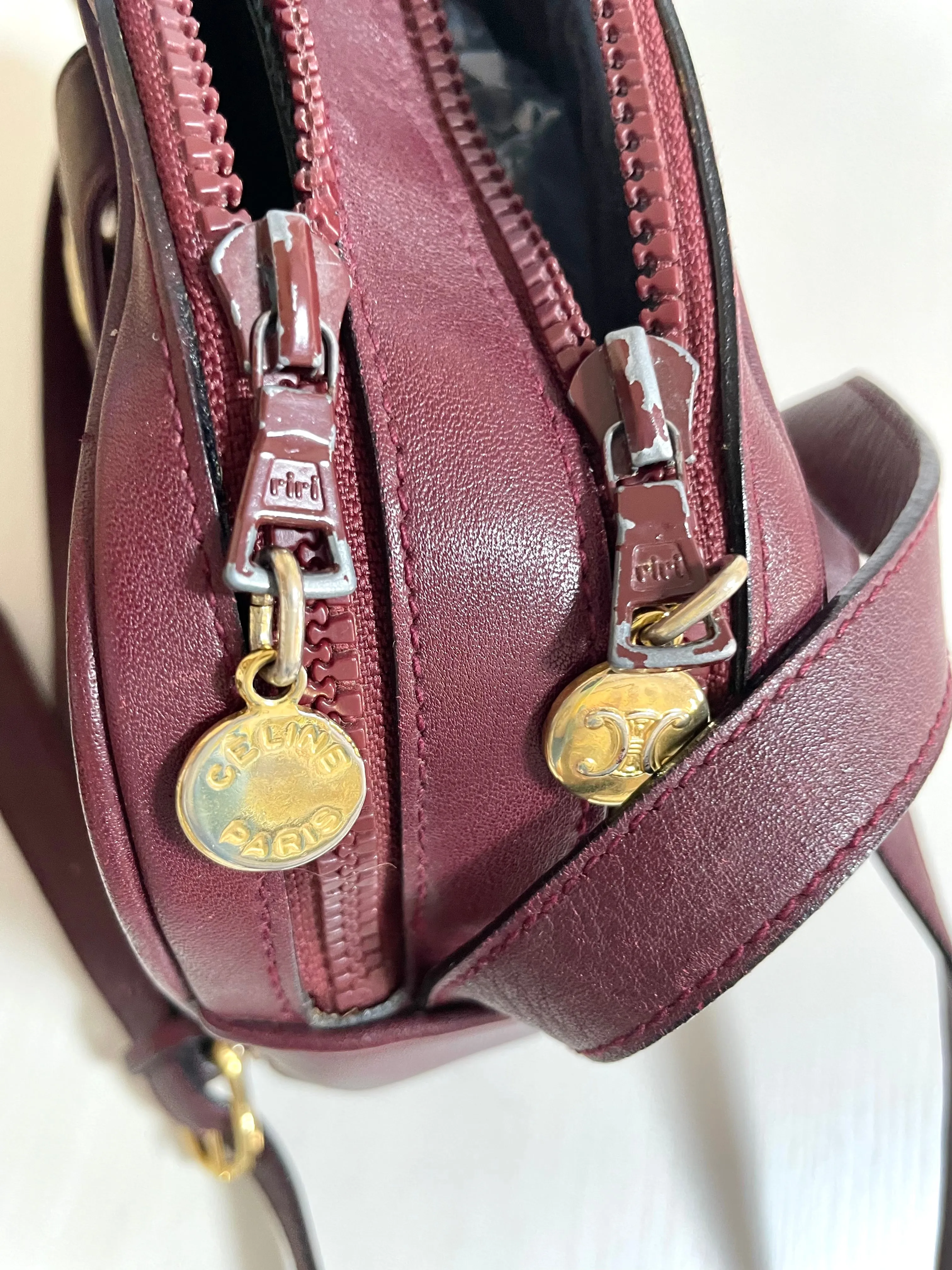 1980s. vintage Celine shoulder purse in bordeaux, burgundy leather with iconic blaison macadam print all over. riri zipper. 0411102