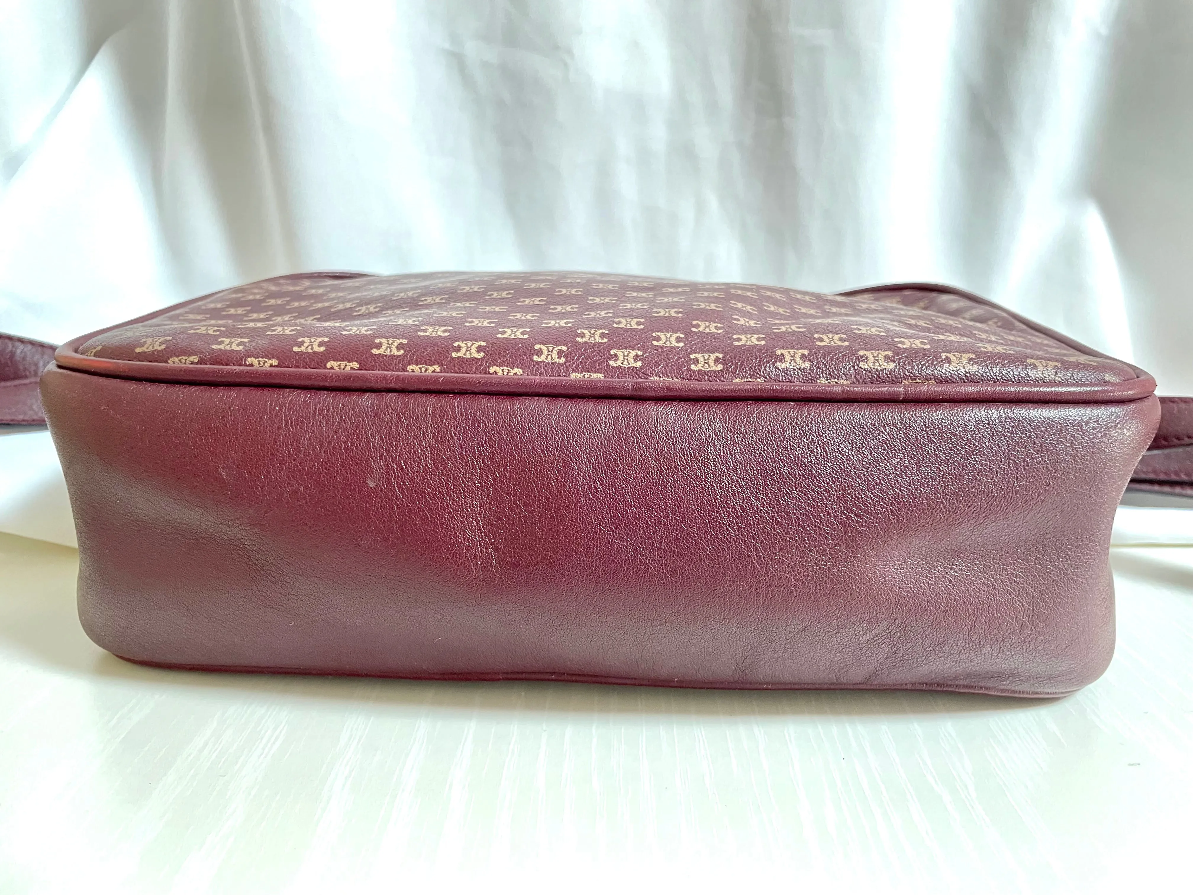 1980s. vintage Celine shoulder purse in bordeaux, burgundy leather with iconic blaison macadam print all over. riri zipper. 0411102