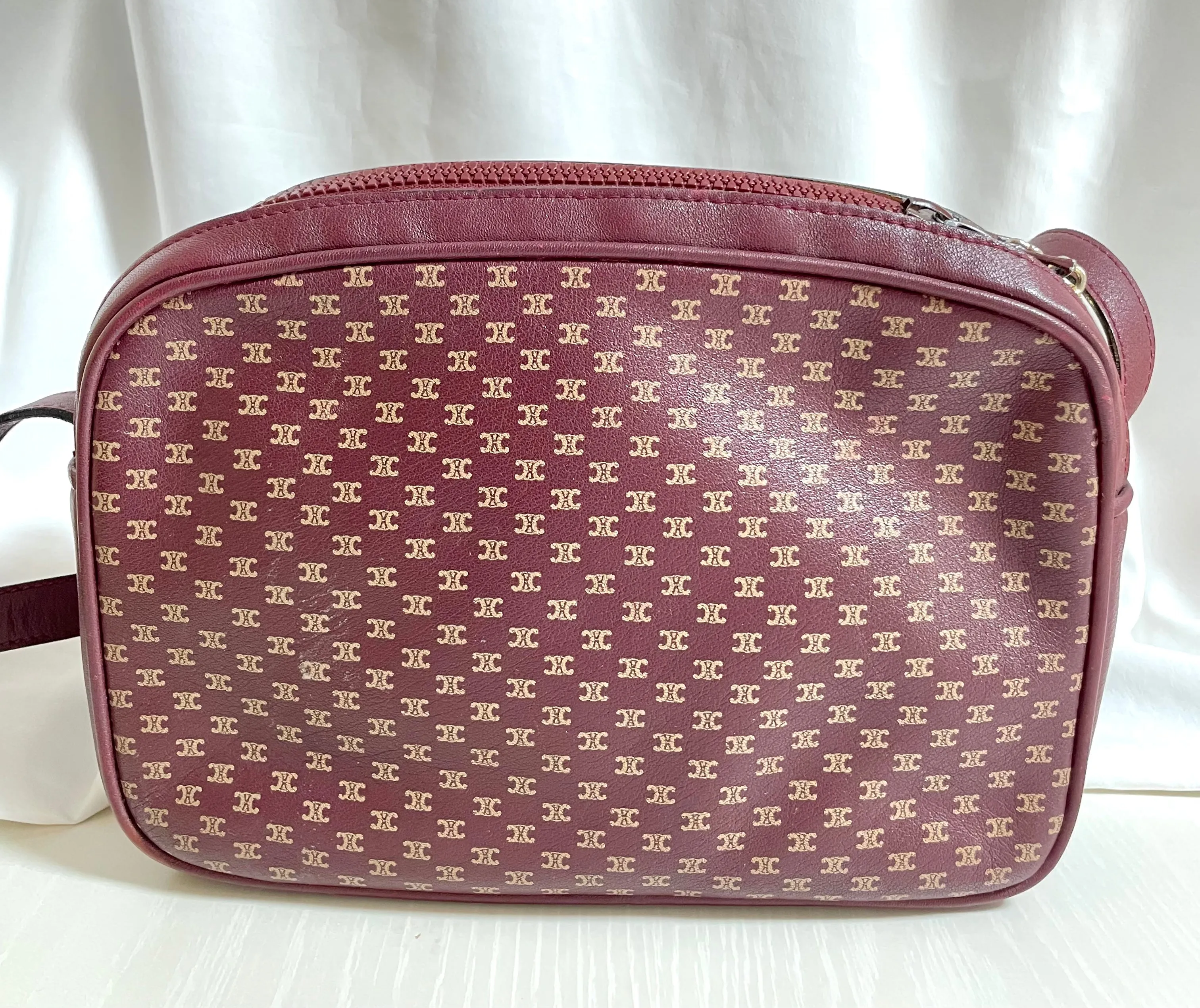 1980s. vintage Celine shoulder purse in bordeaux, burgundy leather with iconic blaison macadam print all over. riri zipper. 0411102