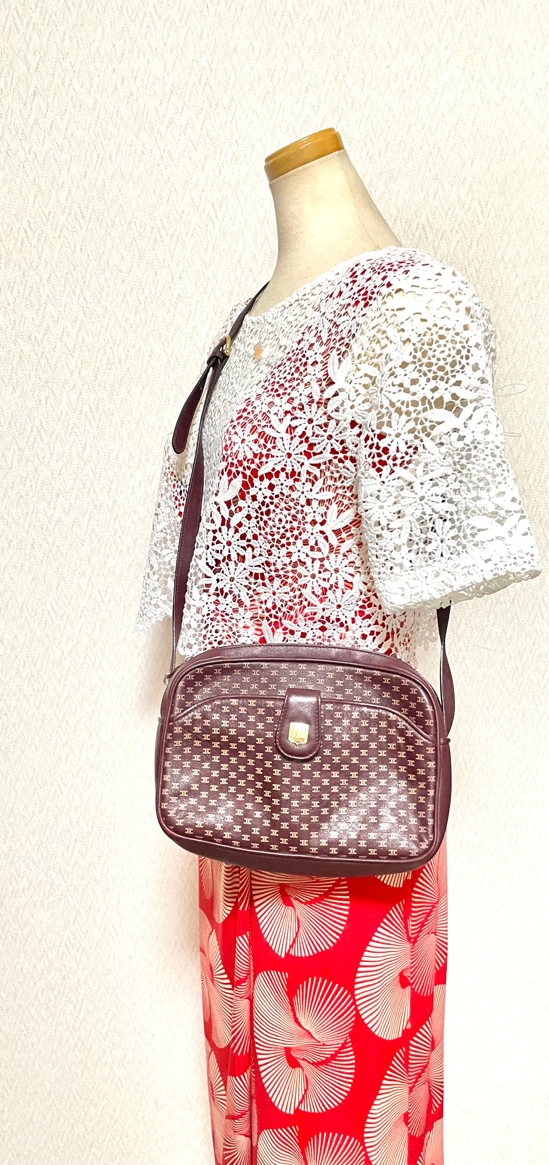 1980s. vintage Celine shoulder purse in bordeaux, burgundy leather with iconic blaison macadam print all over. riri zipper. 0411102