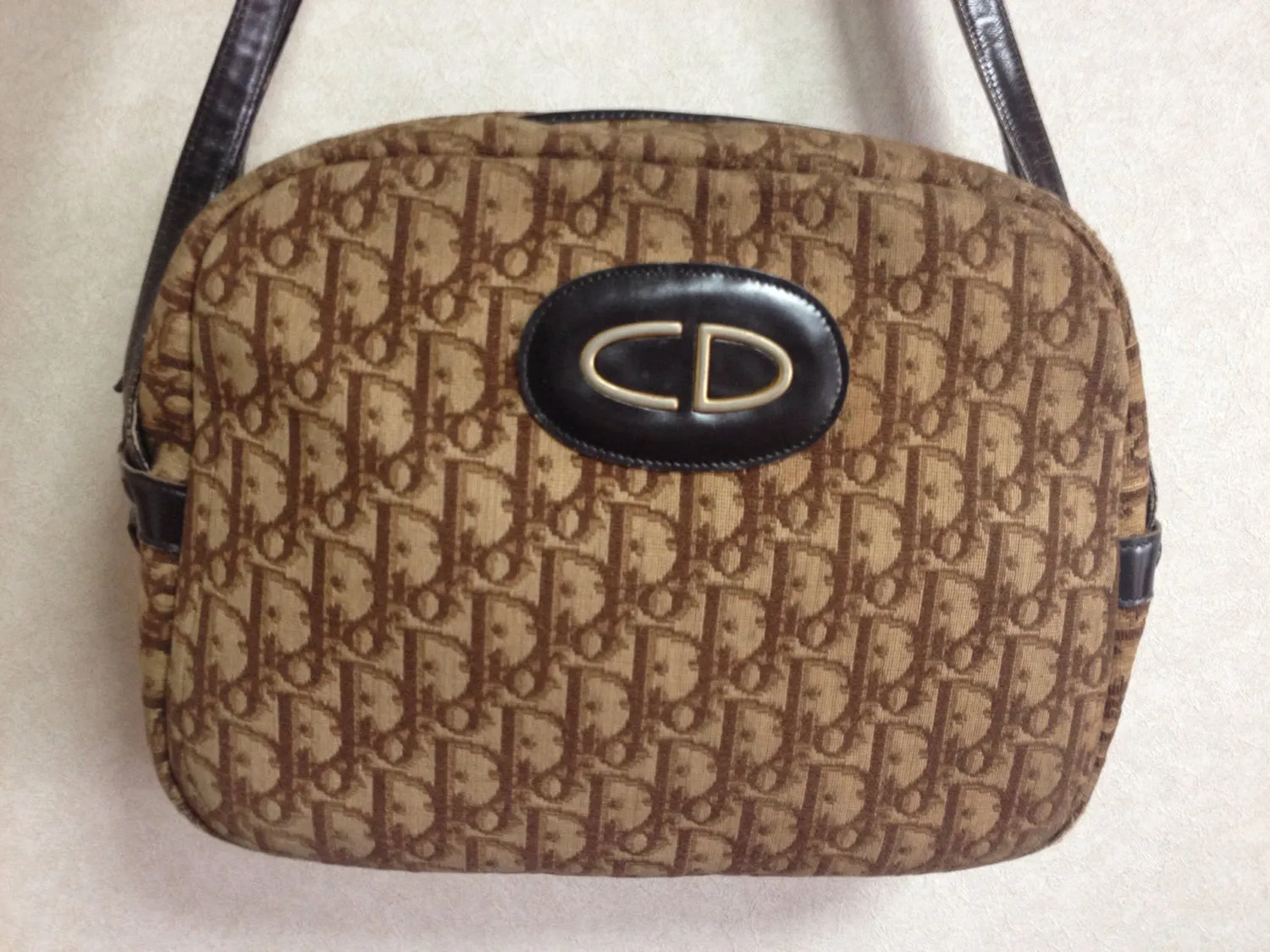 70's vintage Christian Dior brown trotter jacquard handbag with the gold tone large CD motif. ECLAIR zippers. Unisex
