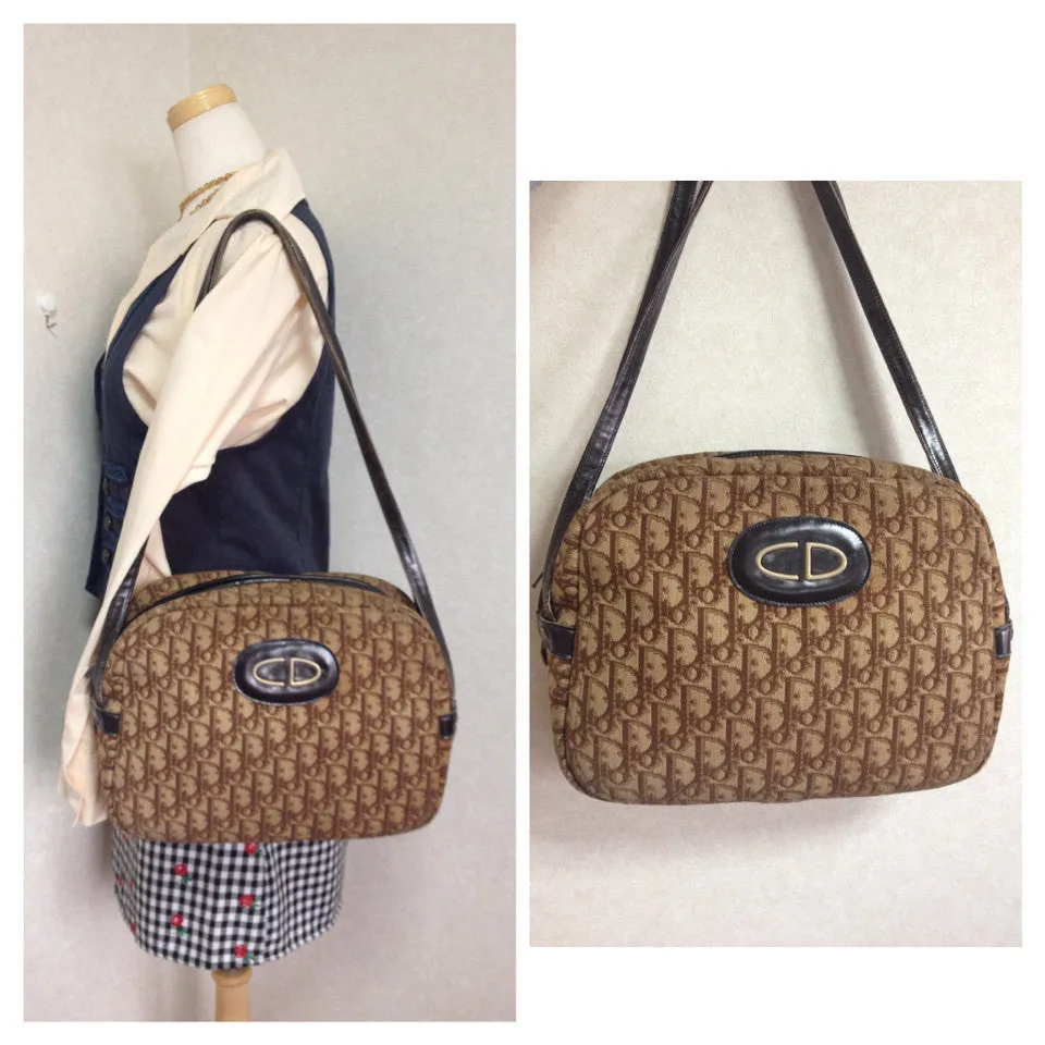70's vintage Christian Dior brown trotter jacquard handbag with the gold tone large CD motif. ECLAIR zippers. Unisex