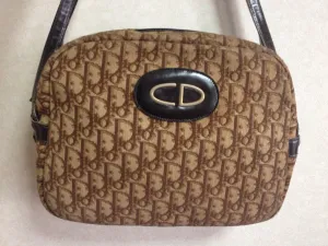 70's vintage Christian Dior brown trotter jacquard handbag with the gold tone large CD motif. ECLAIR zippers. Unisex