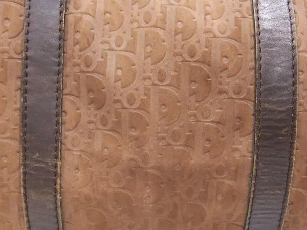 80's vintage Christian Dior Bagages genuine brown suede leather travel duffle bag, purse with embossed Dior logo allover. Unisex luggage
