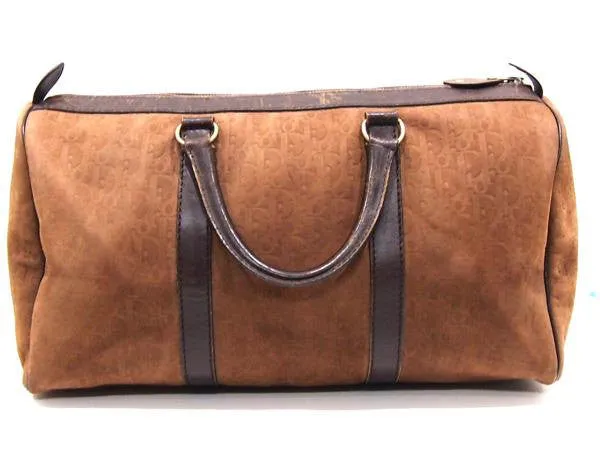 80's vintage Christian Dior Bagages genuine brown suede leather travel duffle bag, purse with embossed Dior logo allover. Unisex luggage