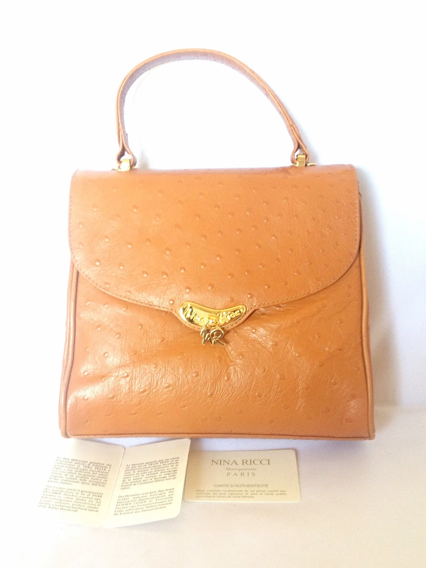 MINT. Vintage Nina Ricci tan brown ostrich-embossed leather handbag purse with golden motif at closure. Masterpiece by Maroquinerie