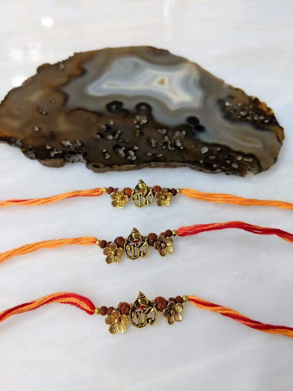 (Set of 3) Ganesh Ji Rakhi for Men Gold Flower Rudraksha Beads Rakhi