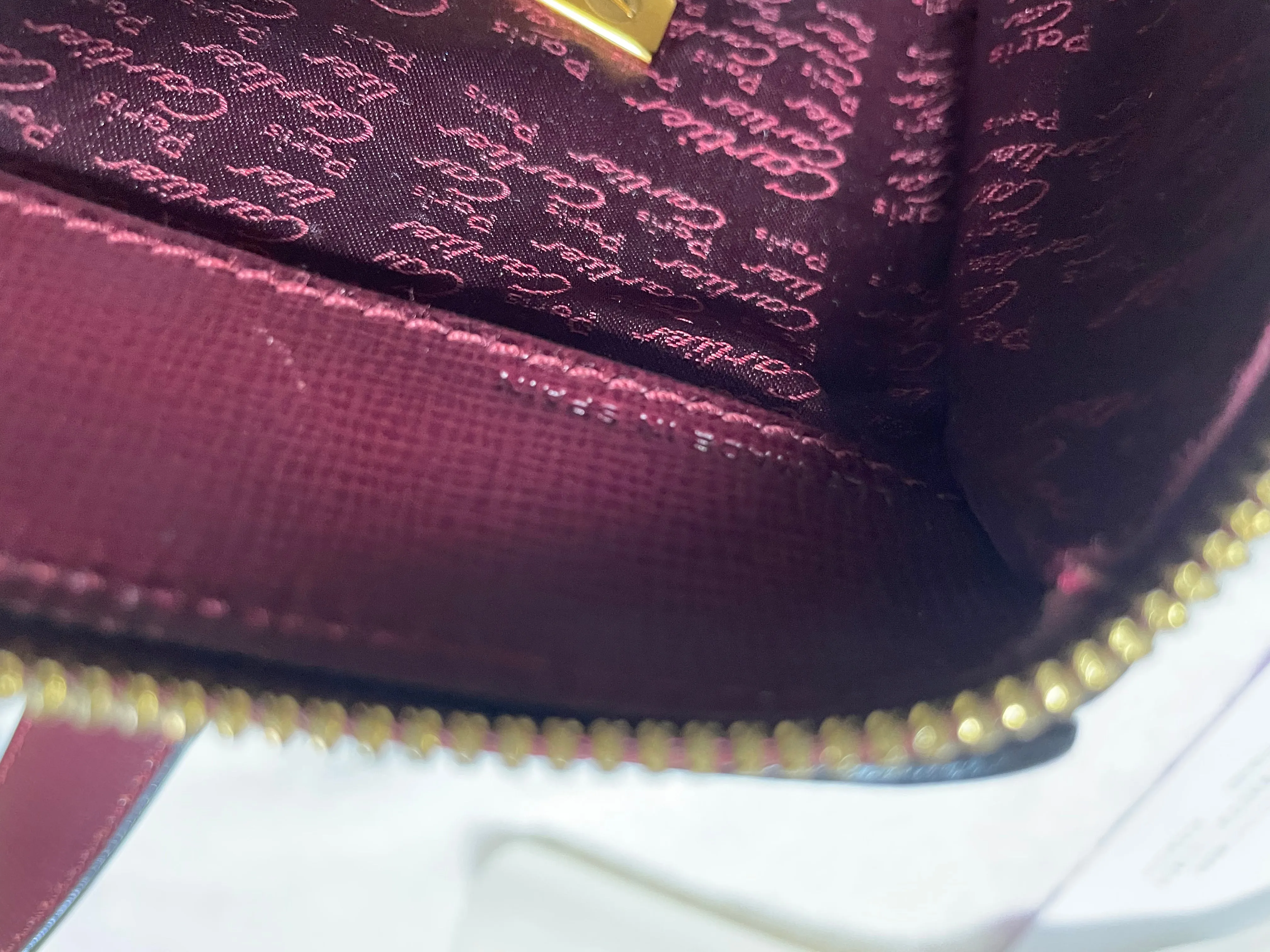 Vintage Cartier classic wine, bordeaux leather handbag purse with bullet design gold hardware at handles. Must de Cartier. 0408171
