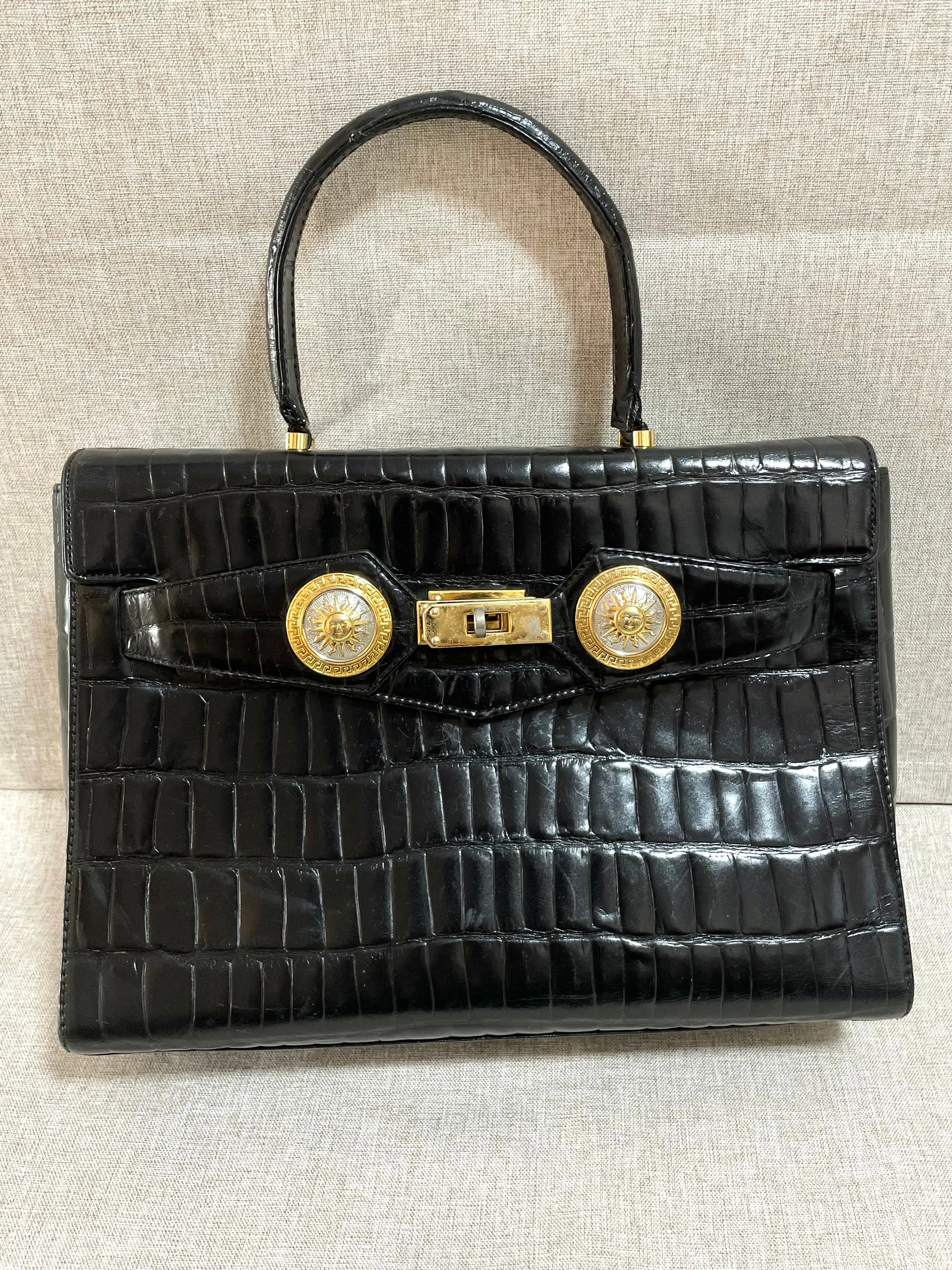 Vintage Gianni Versace black croc embossed leather handbag with Medallion Sunburst charms. Gorgeous masterpiece. 061104y1