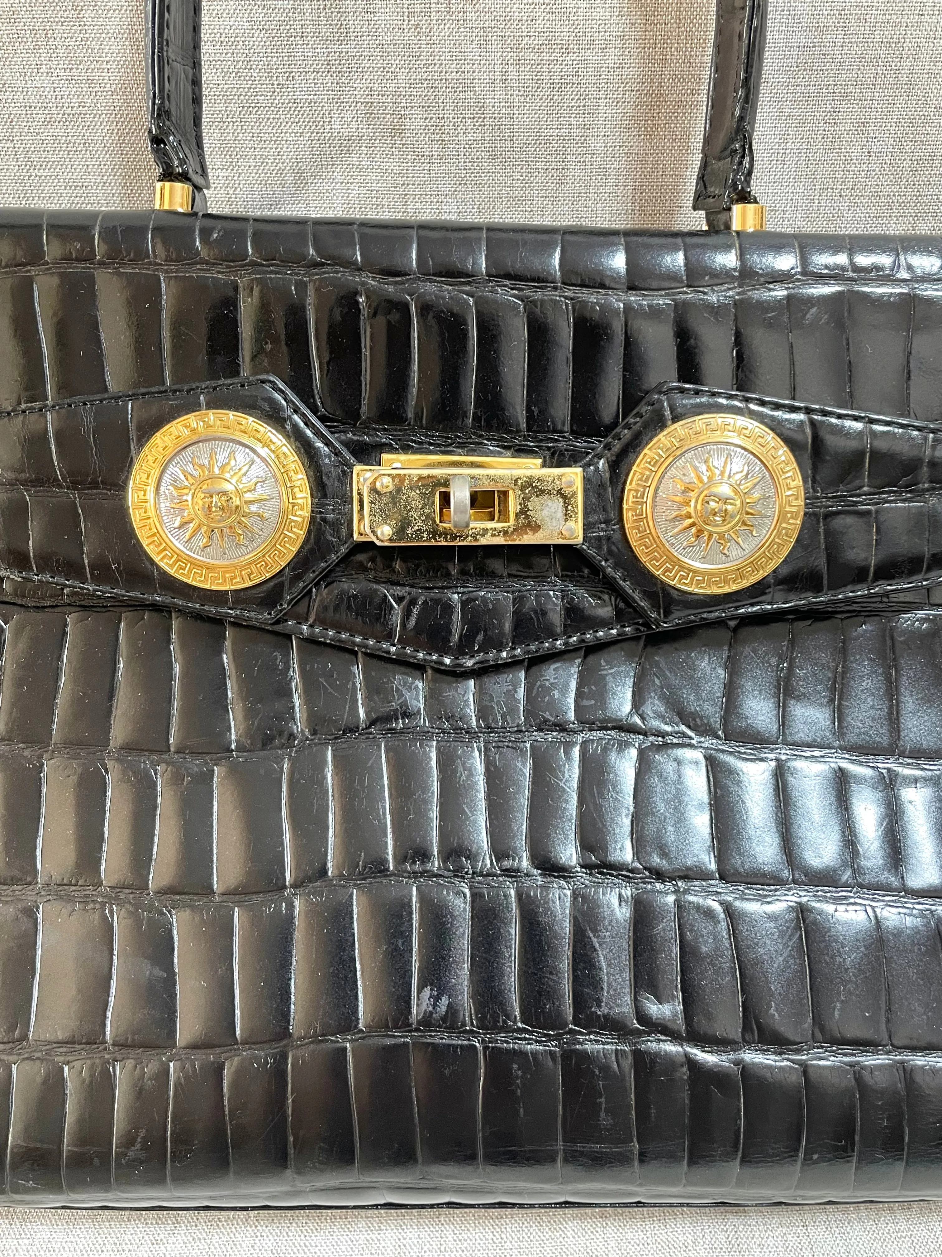 Vintage Gianni Versace black croc embossed leather handbag with Medallion Sunburst charms. Gorgeous masterpiece. 061104y1