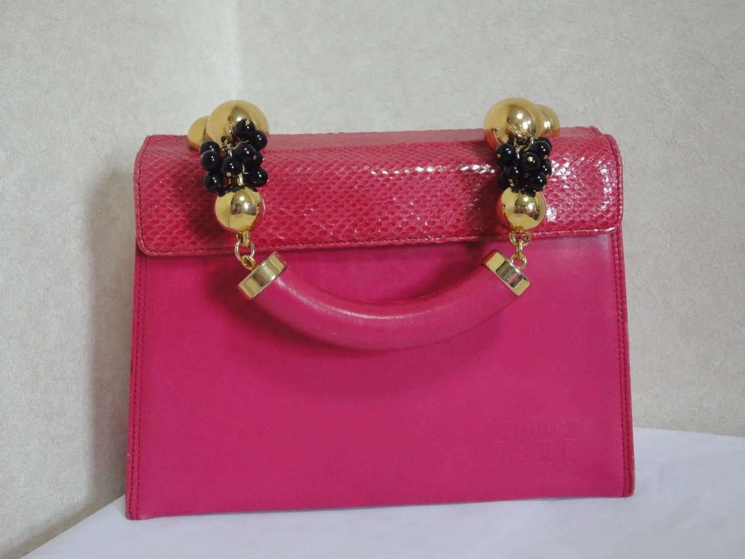 Vintage Gianni Versace pink calf leather and genuine snakeskin handbag with golden and black balls handles.