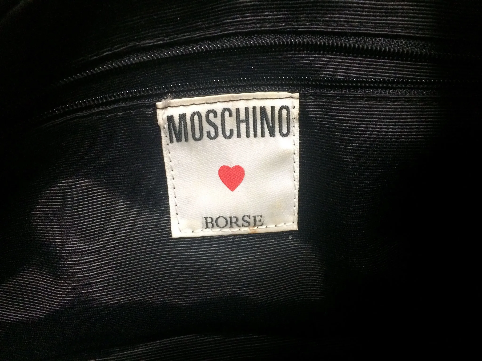 Vintage MOSCHINO black and ivory beige logo M print handbag, mini duffle bag with leather trimmings and golden M charms. 060521re1