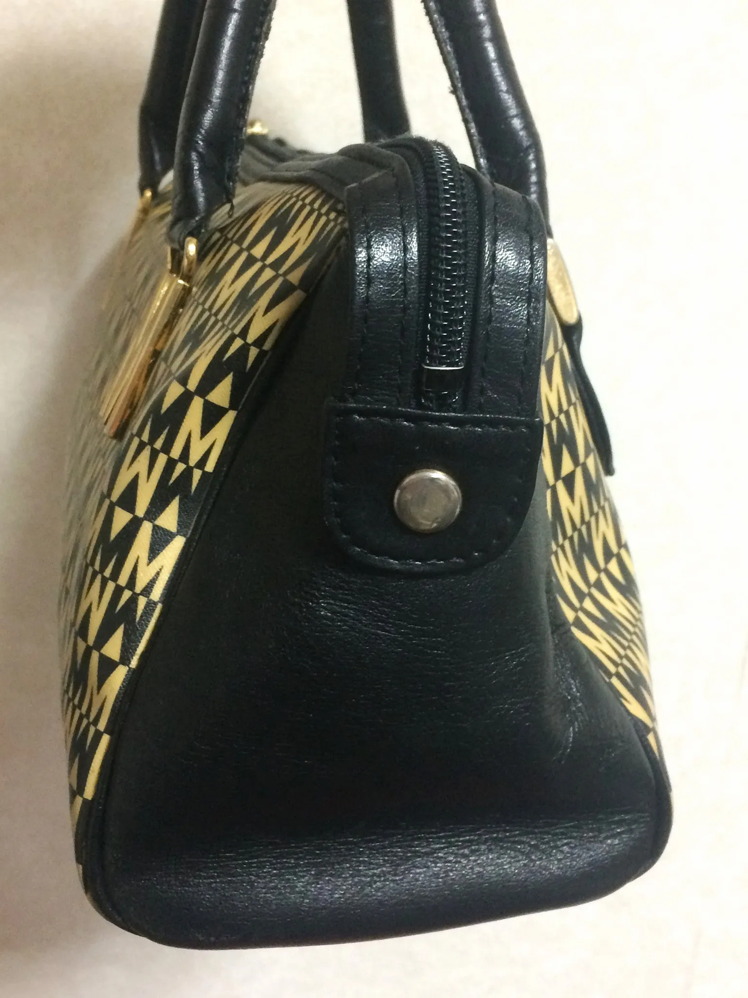 Vintage MOSCHINO black and ivory beige logo M print handbag, mini duffle bag with leather trimmings and golden M charms. 060521re1