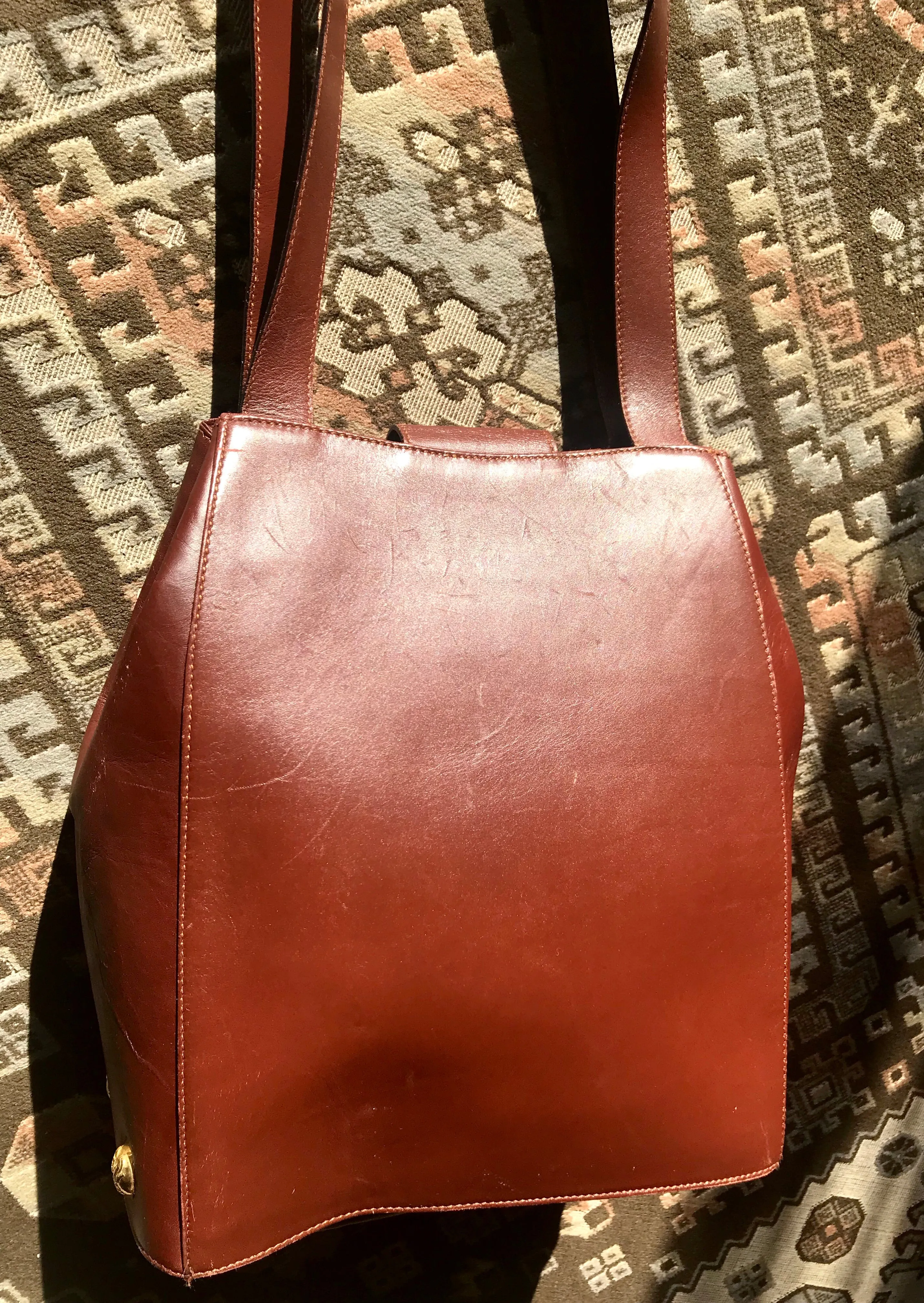 Vintage Salvatore Ferragamo brown leather purse with gold tone elegant closure. Featuring Ferragamo charms. 060516re4