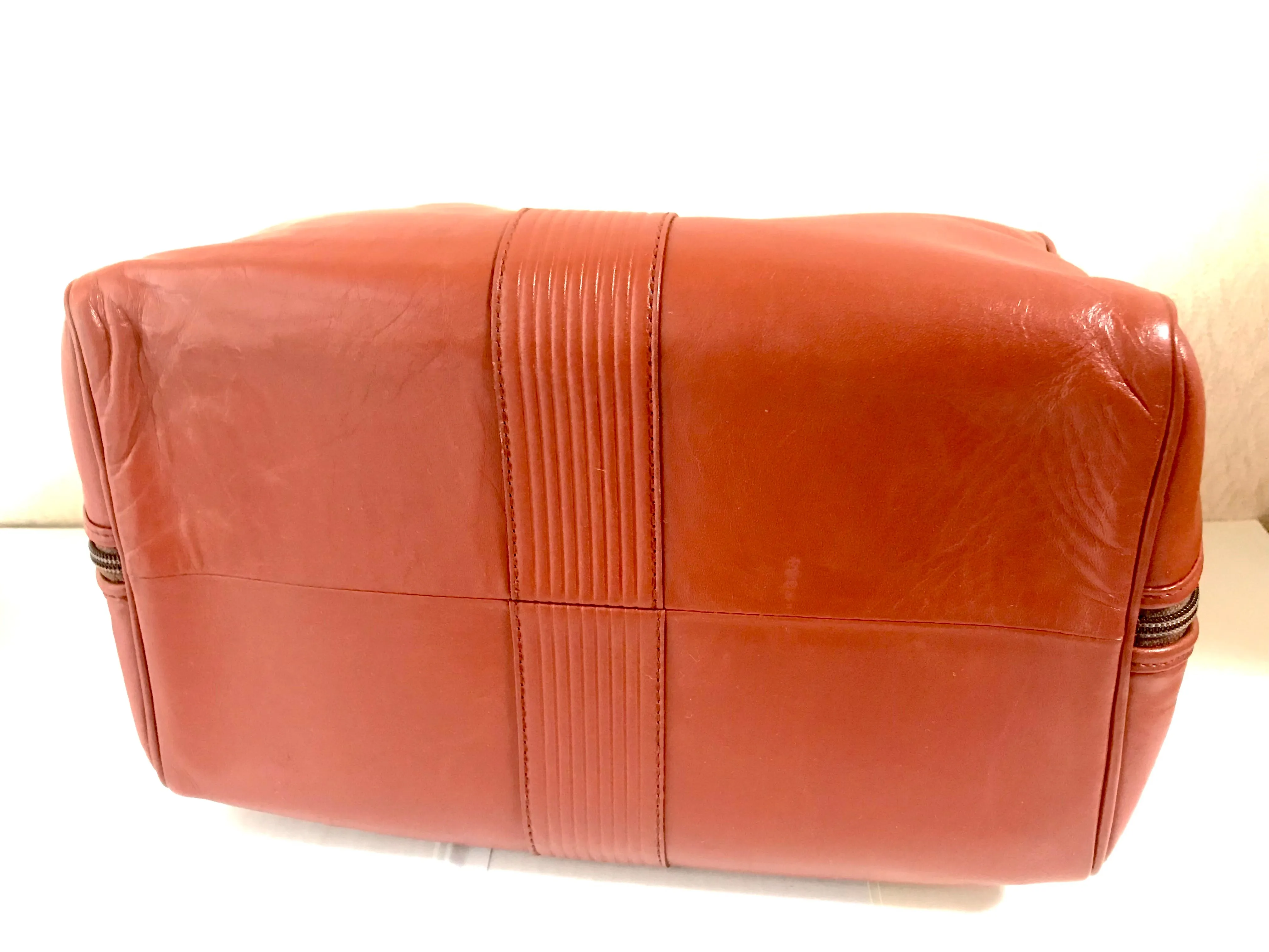 Vintage Yves Saint Laurent brown leather handbag with YSL marks. Classic unisex use bag, speedy bag.