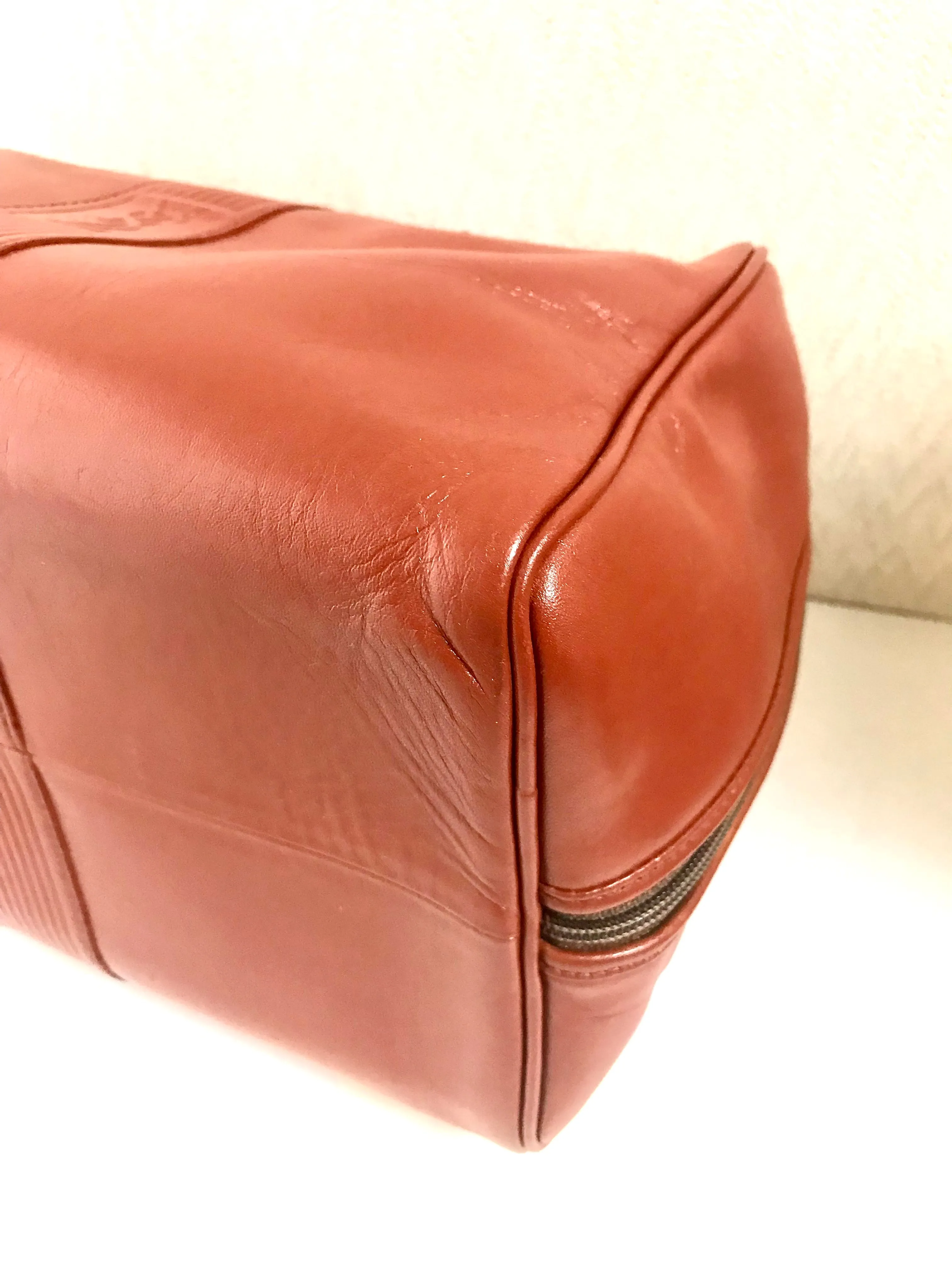 Vintage Yves Saint Laurent brown leather handbag with YSL marks. Classic unisex use bag, speedy bag.