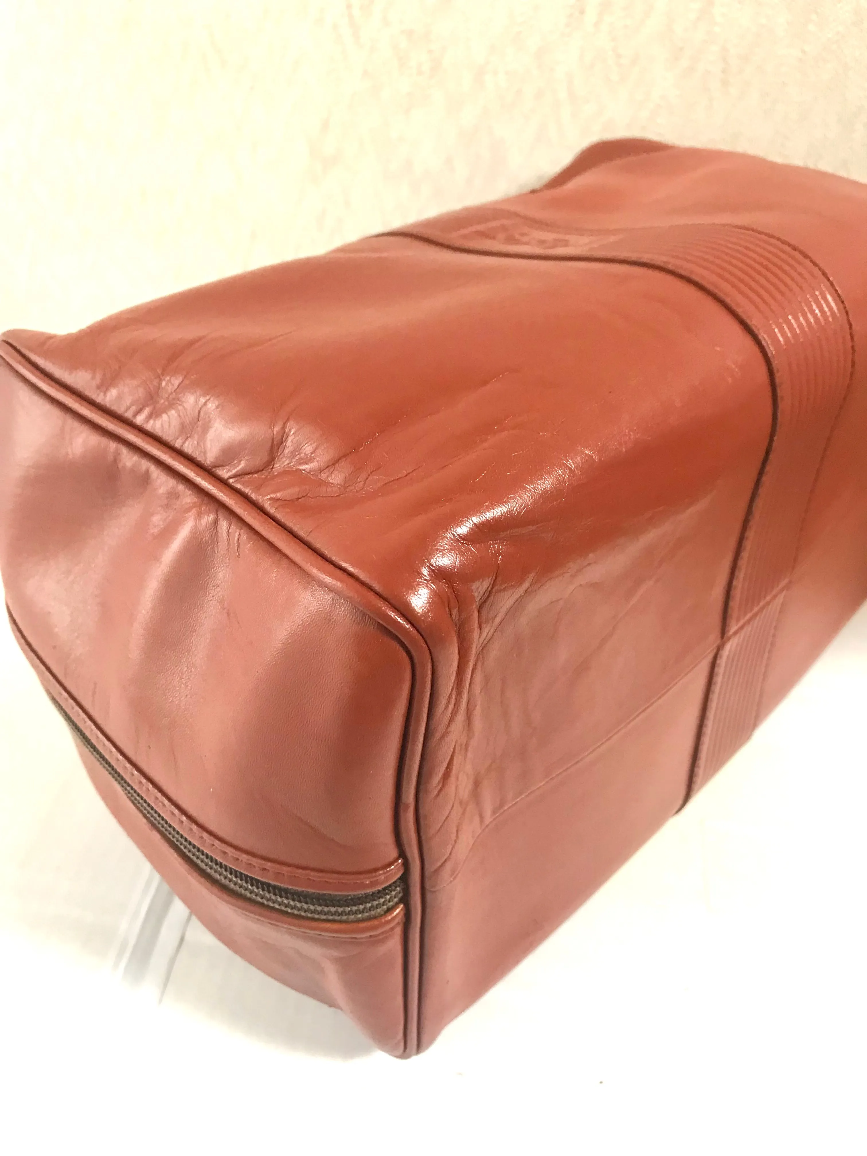 Vintage Yves Saint Laurent brown leather handbag with YSL marks. Classic unisex use bag, speedy bag.