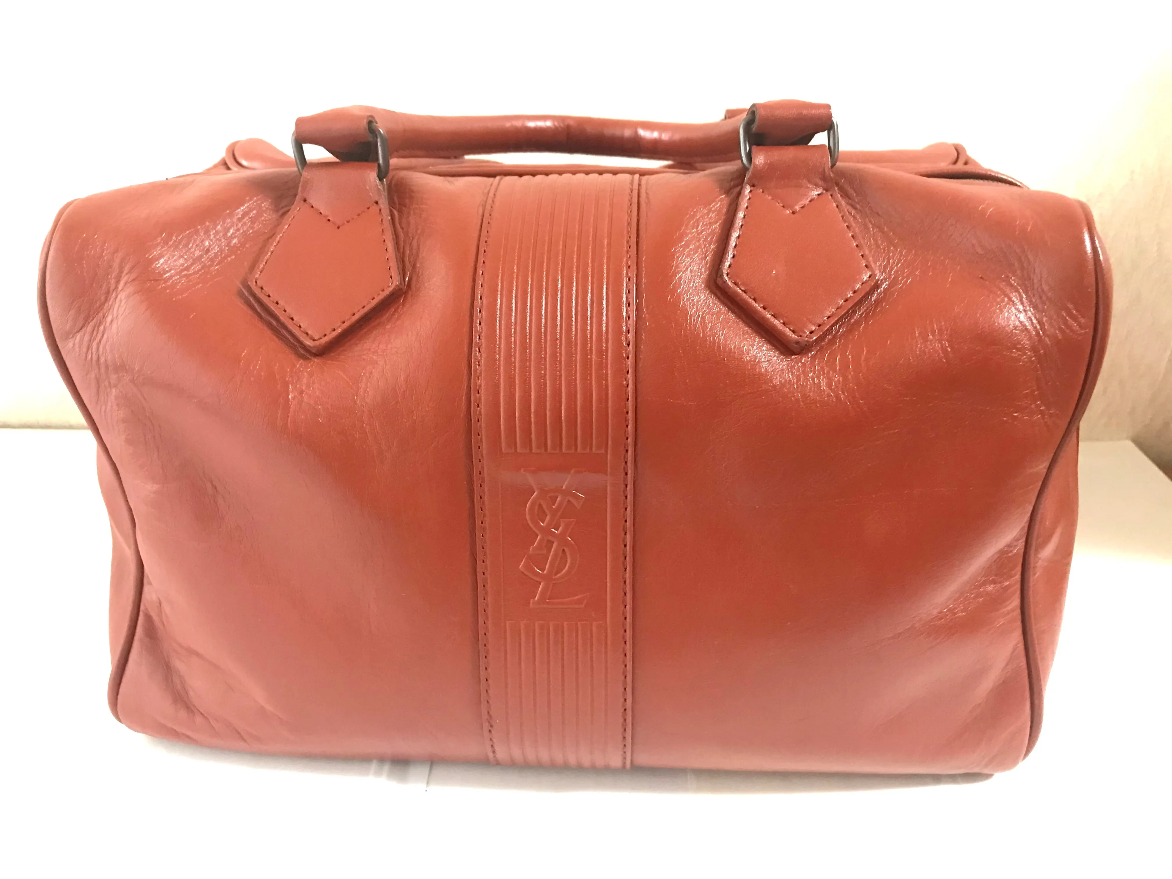 Vintage Yves Saint Laurent brown leather handbag with YSL marks. Classic unisex use bag, speedy bag.