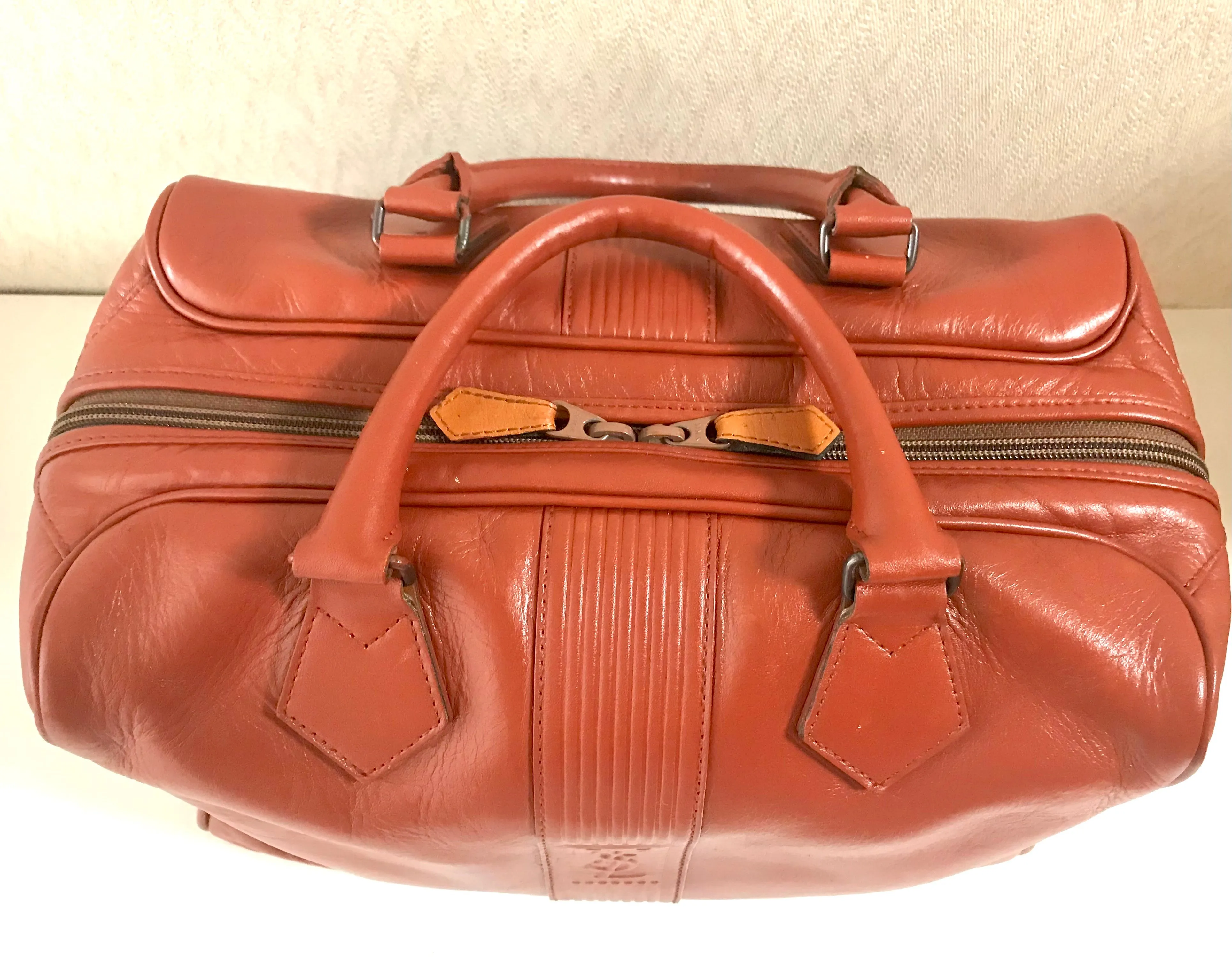 Vintage Yves Saint Laurent brown leather handbag with YSL marks. Classic unisex use bag, speedy bag.
