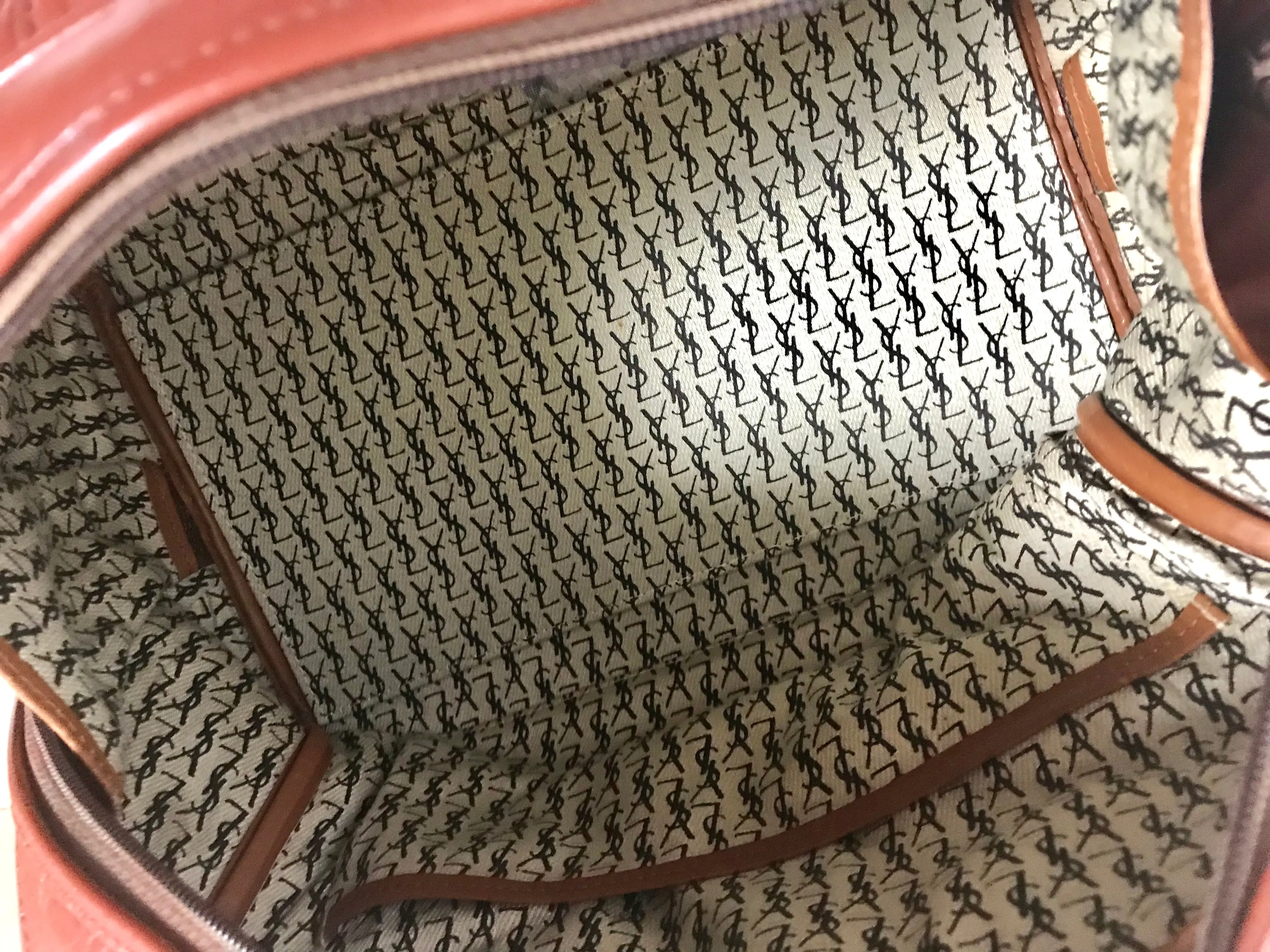 Vintage Yves Saint Laurent brown leather handbag with YSL marks. Classic unisex use bag, speedy bag.